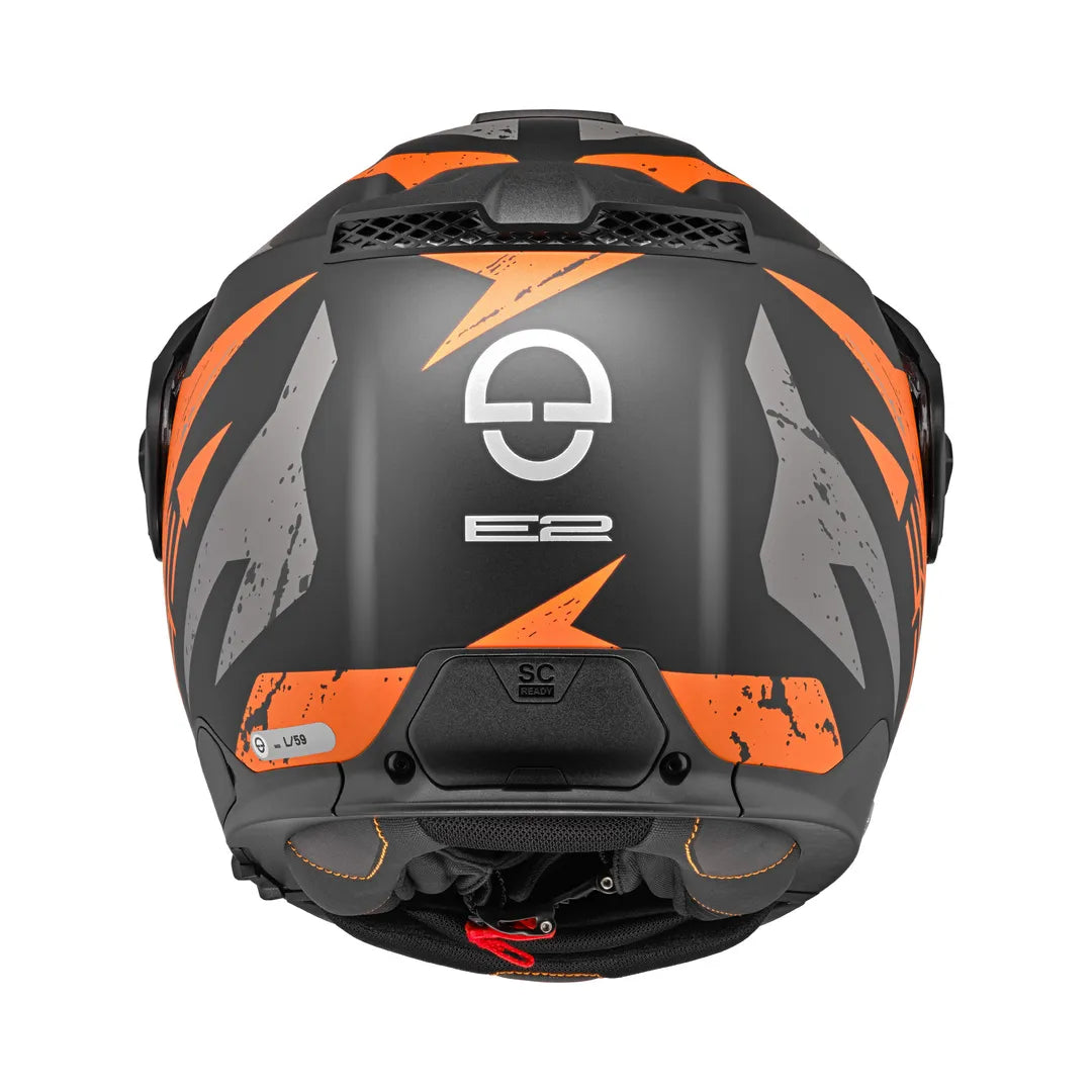 Baksidan av Schuberth öppningsbar mc-hjälm E2 Explorer Orange med E2-logotyp och integrerat säkerhetssystem.